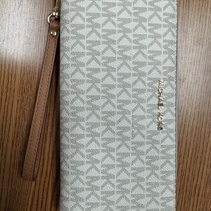 Michael Kors Beige Logo Wristlet with Brown Strap/jet set travel large